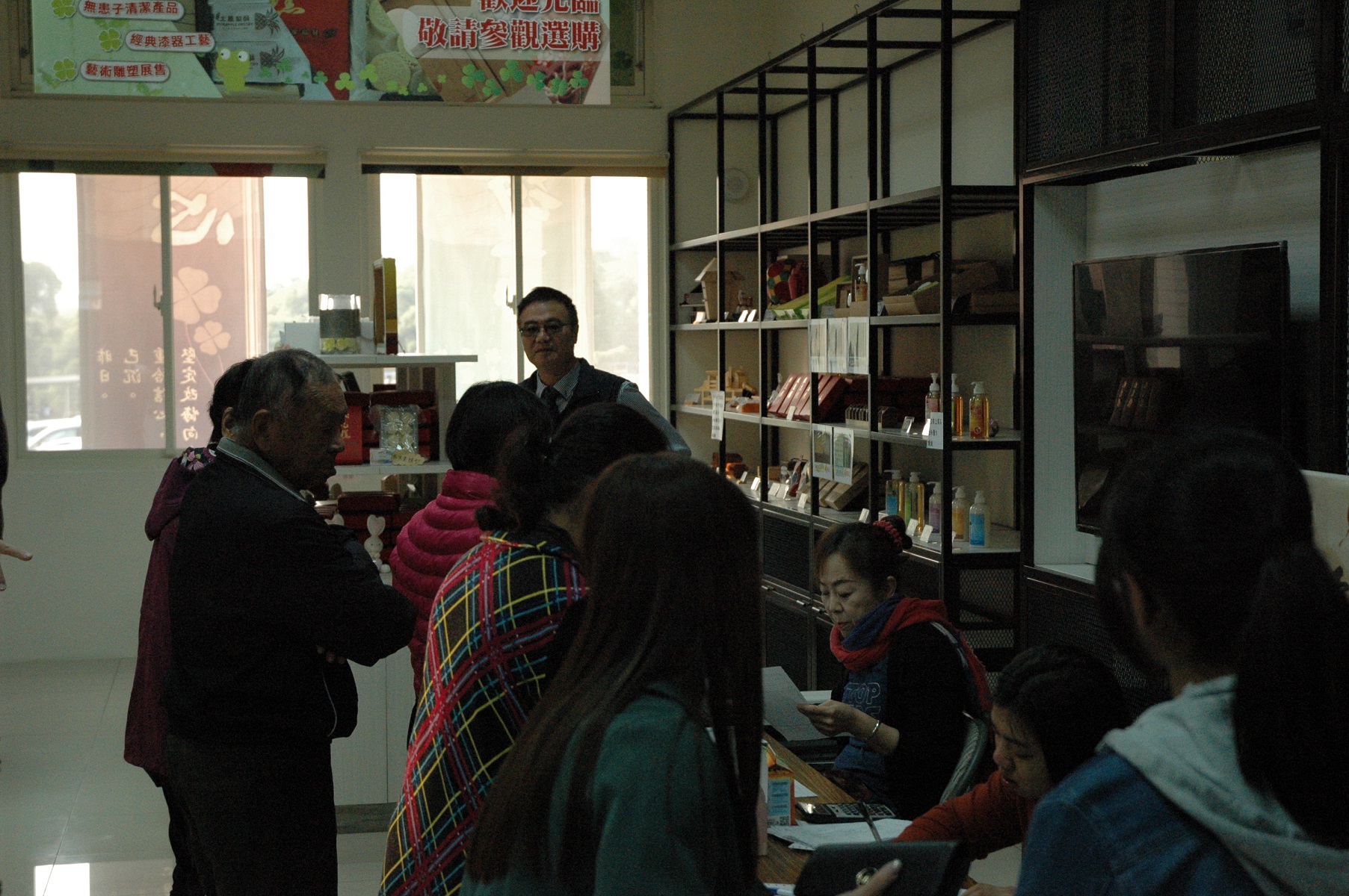 Family buy boxed meals at sales counter