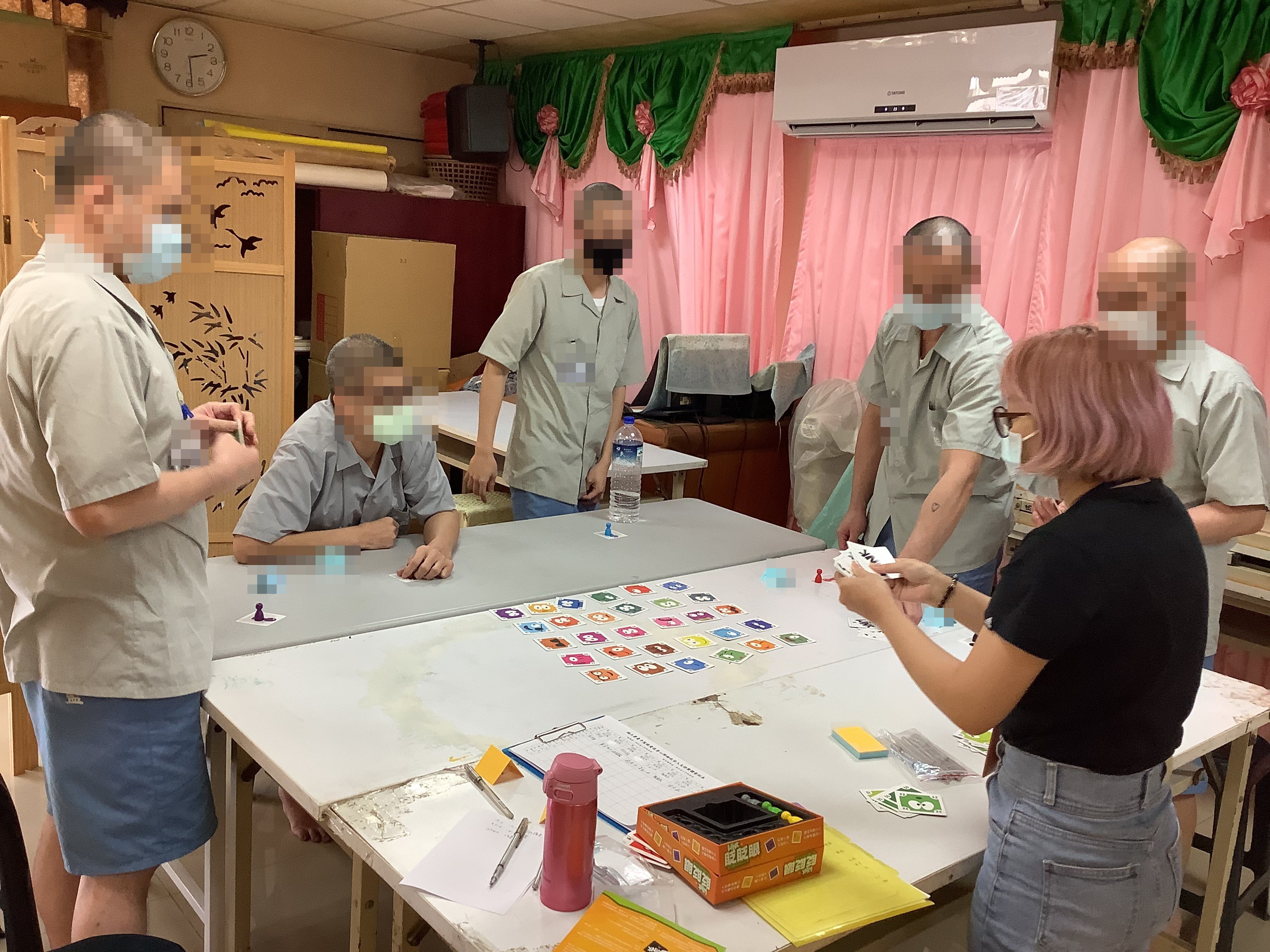 Members actively listening as the teacher explains the game rules