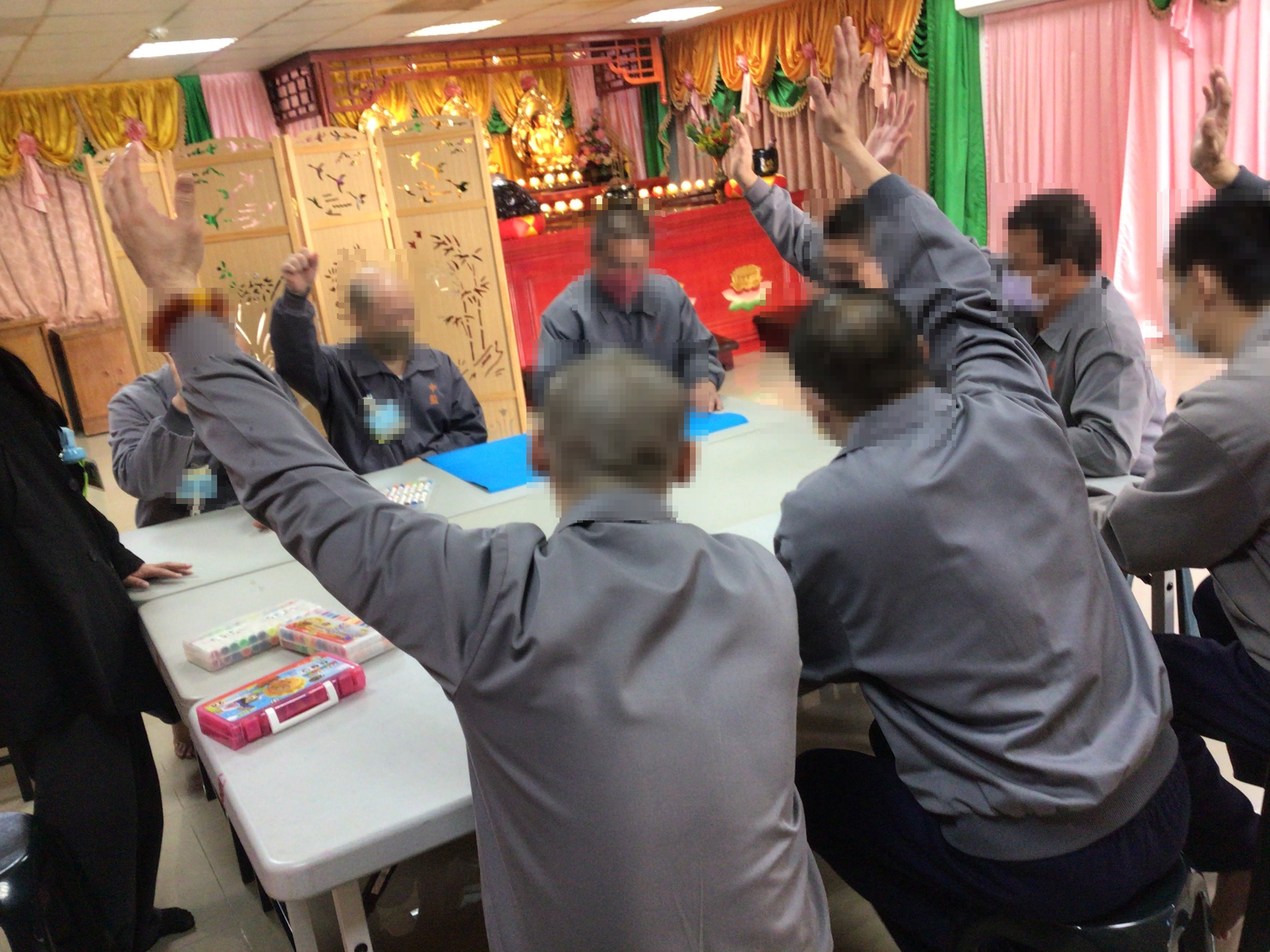 Participants raise their hands when they agree the group norms