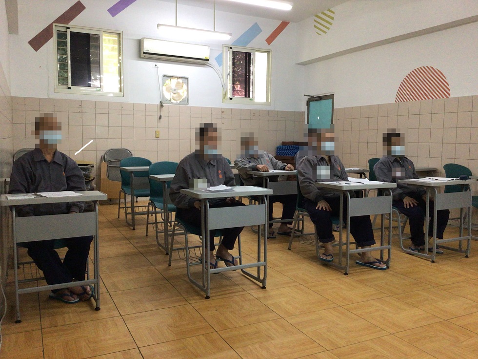 Inmates practice the relaxation techniques for sleeping.