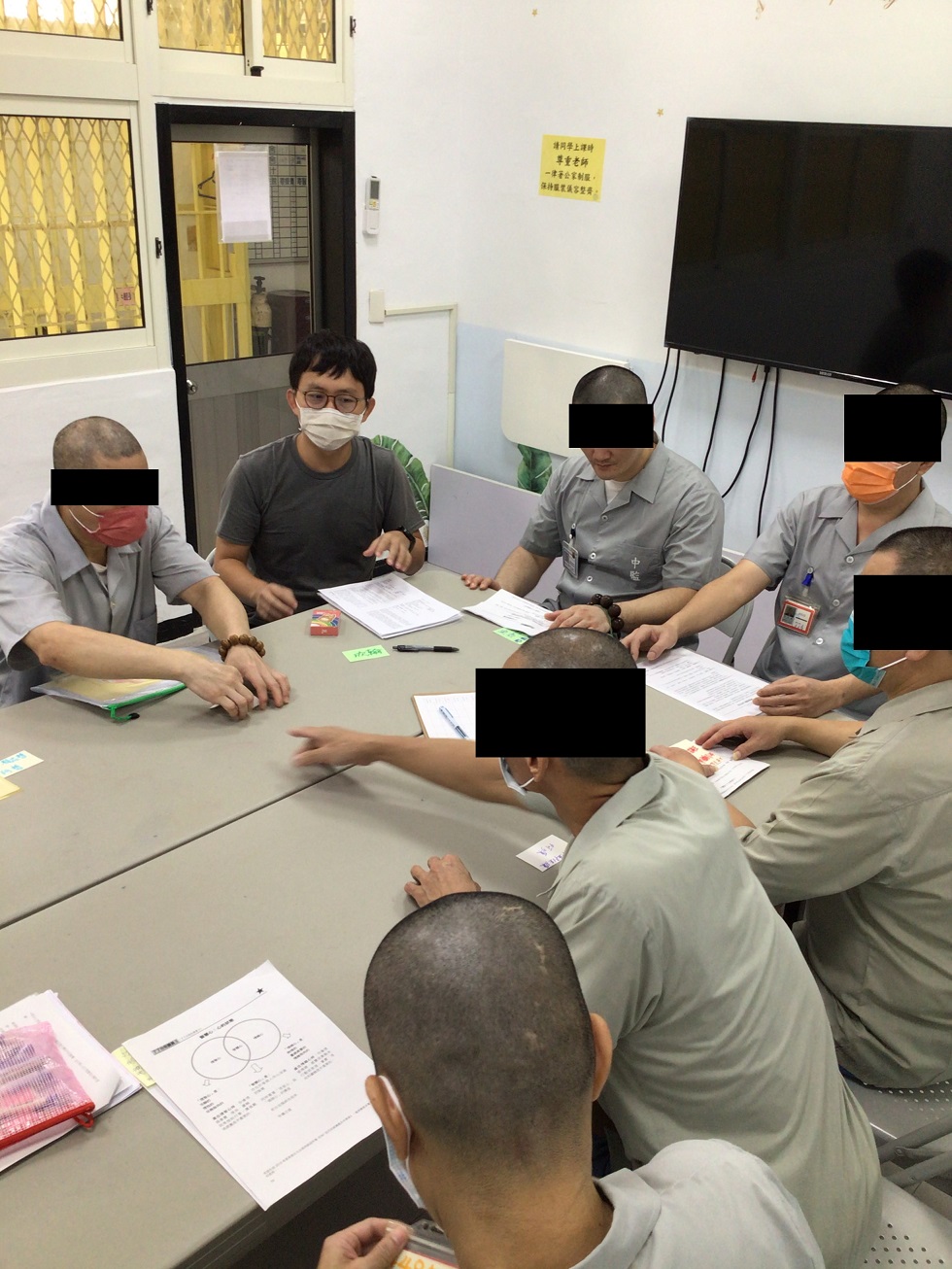 Inmates study and discuss in a group to develop critical-thinking, communication and decision-making skills.